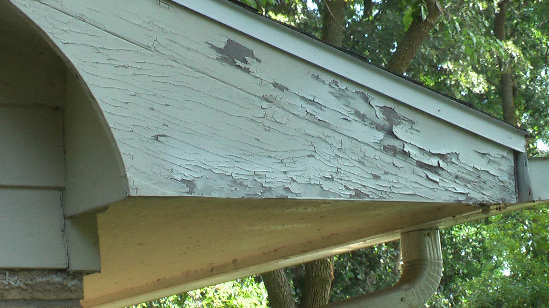 Peeling exterior fascia before repair and paint