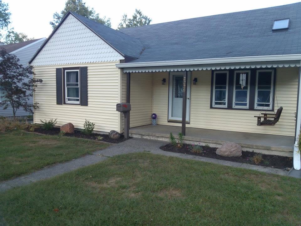 Refreshed home exterior with porch awning